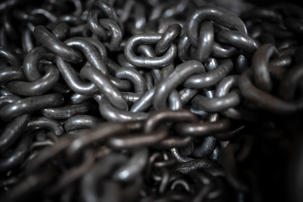 A large metal chain from an air hoist