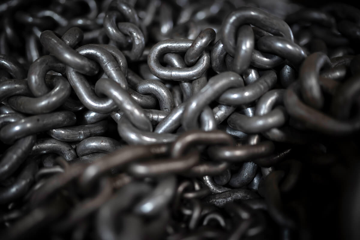A large metal chain from an air hoist