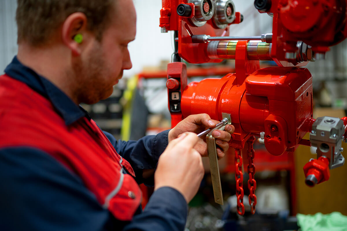An air hoist operator inspecting the hoist - Red Rooster Lifting
