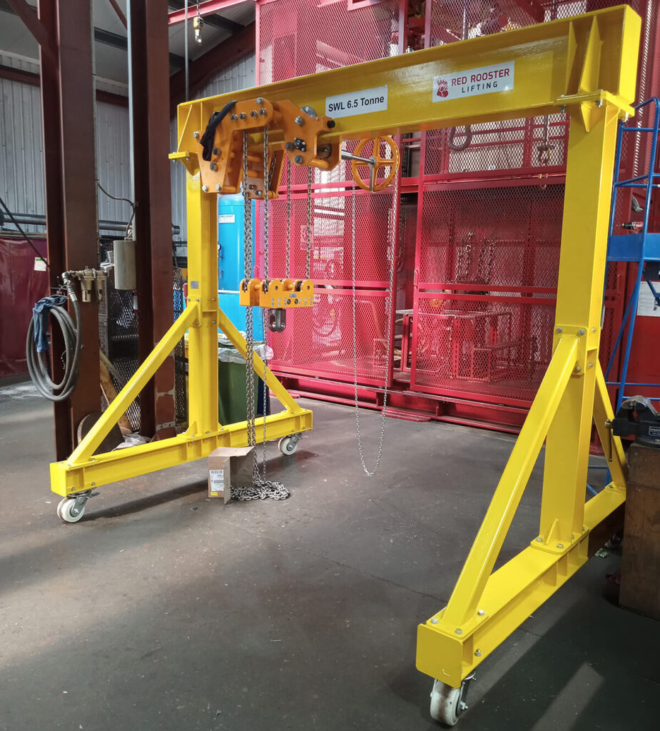 Custom ultra low headroom manual chain hoist and gantry frame assembled in Red Rooster Lifting workshop.