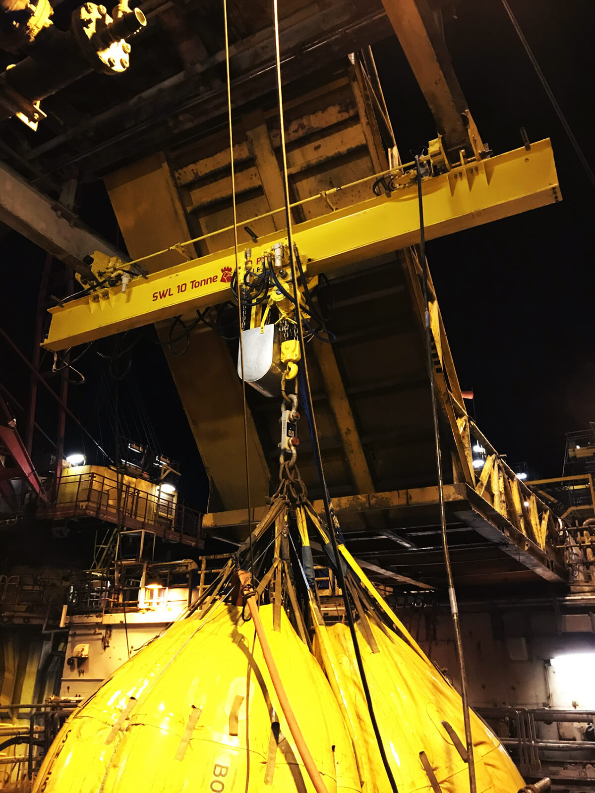 10 tonne ATEX pneumatic overhead crane installed on offshore platform in operation lifting components