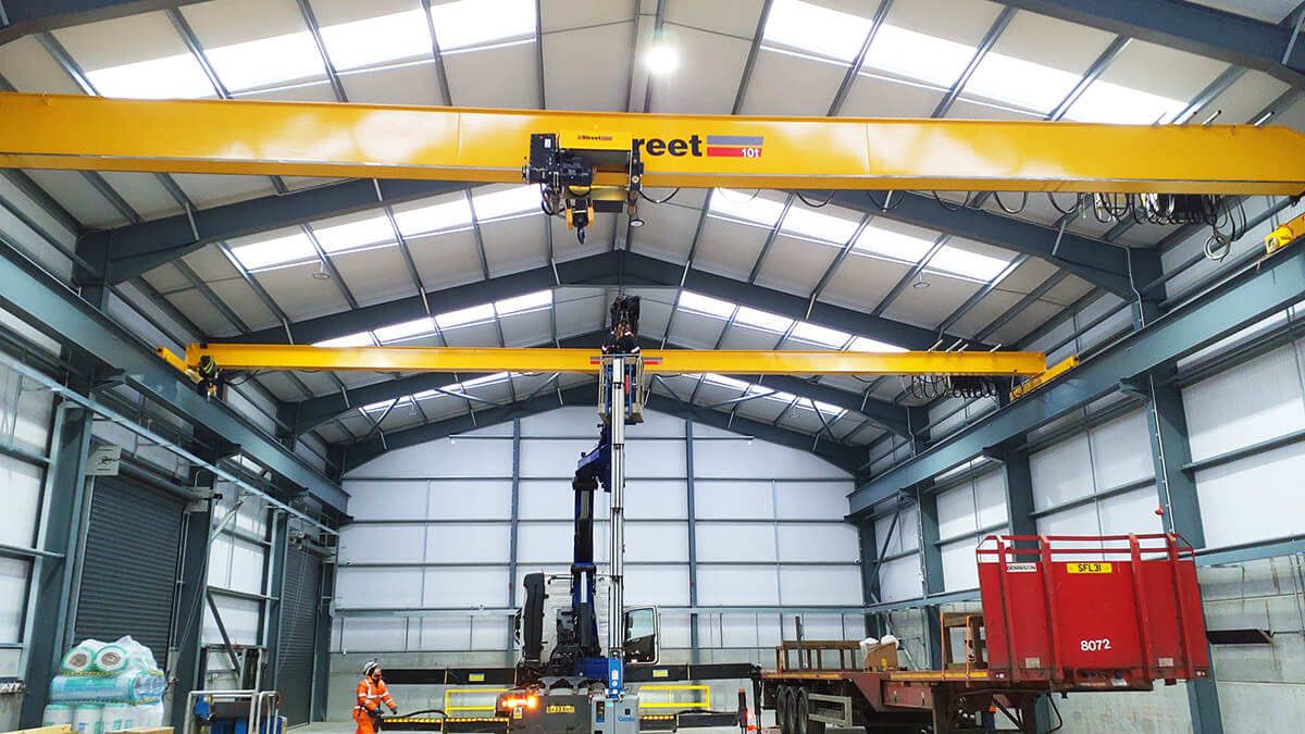 Two single girder overhead cranes installed and commissioned in a new fabrication facility supporting renewable energy projects.