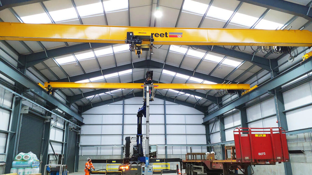 Two single girder overhead cranes installed and commissioned in a new fabrication facility supporting renewable energy projects.