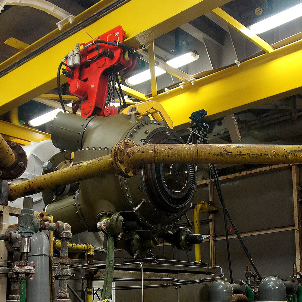 Low headroom air hoist positioned above gas turbine during offshore replacement project